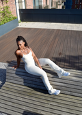 Nude flare yoga pants with a high waist, made from a stretchy and breathable fabric. The pants feature a snug fit through the hips and thighs, flaring out from the knees for a comfortable and stylish look. Ideal for yoga, workouts, or casual wear.